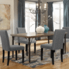 Modern grey fabric dining chairs in a stylish Dubai apartment dining room