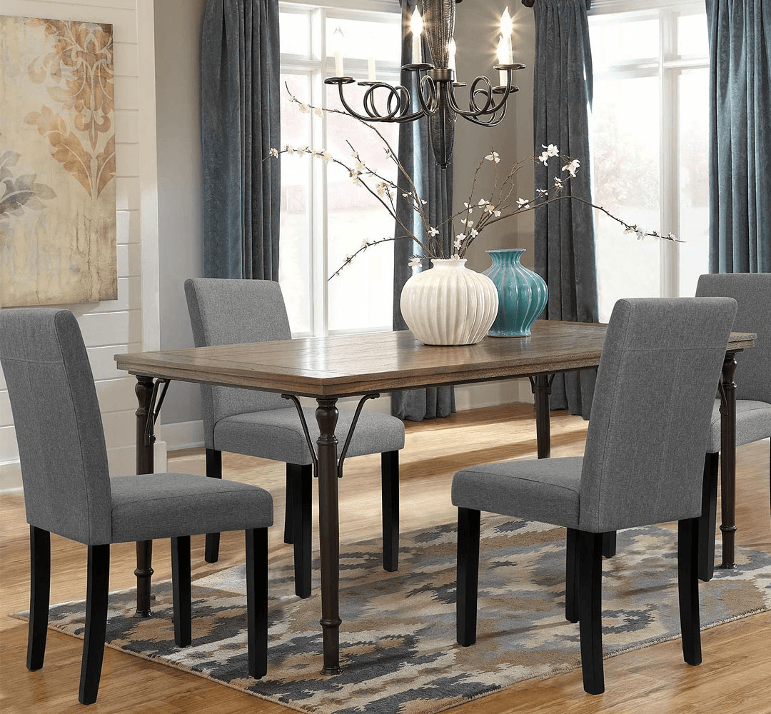 Modern grey fabric dining chairs in a stylish Dubai apartment dining room