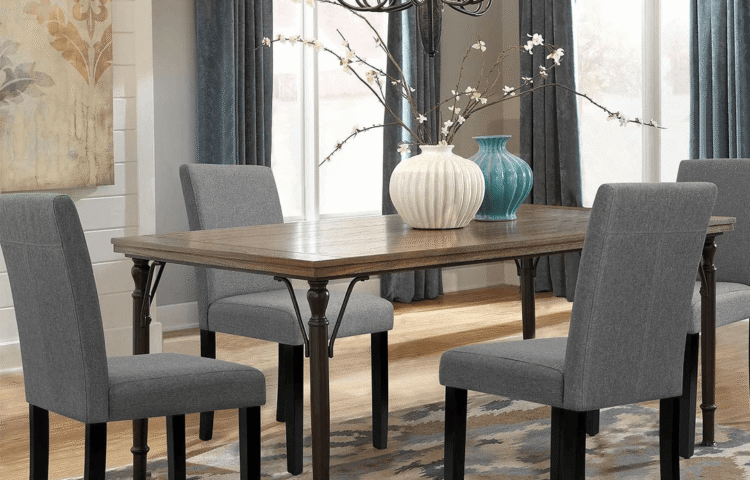 Modern grey fabric dining chairs in a stylish Dubai apartment dining room